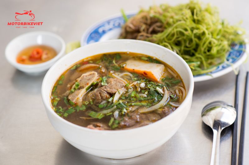 Enjoys dinner featuring bun bo Hue